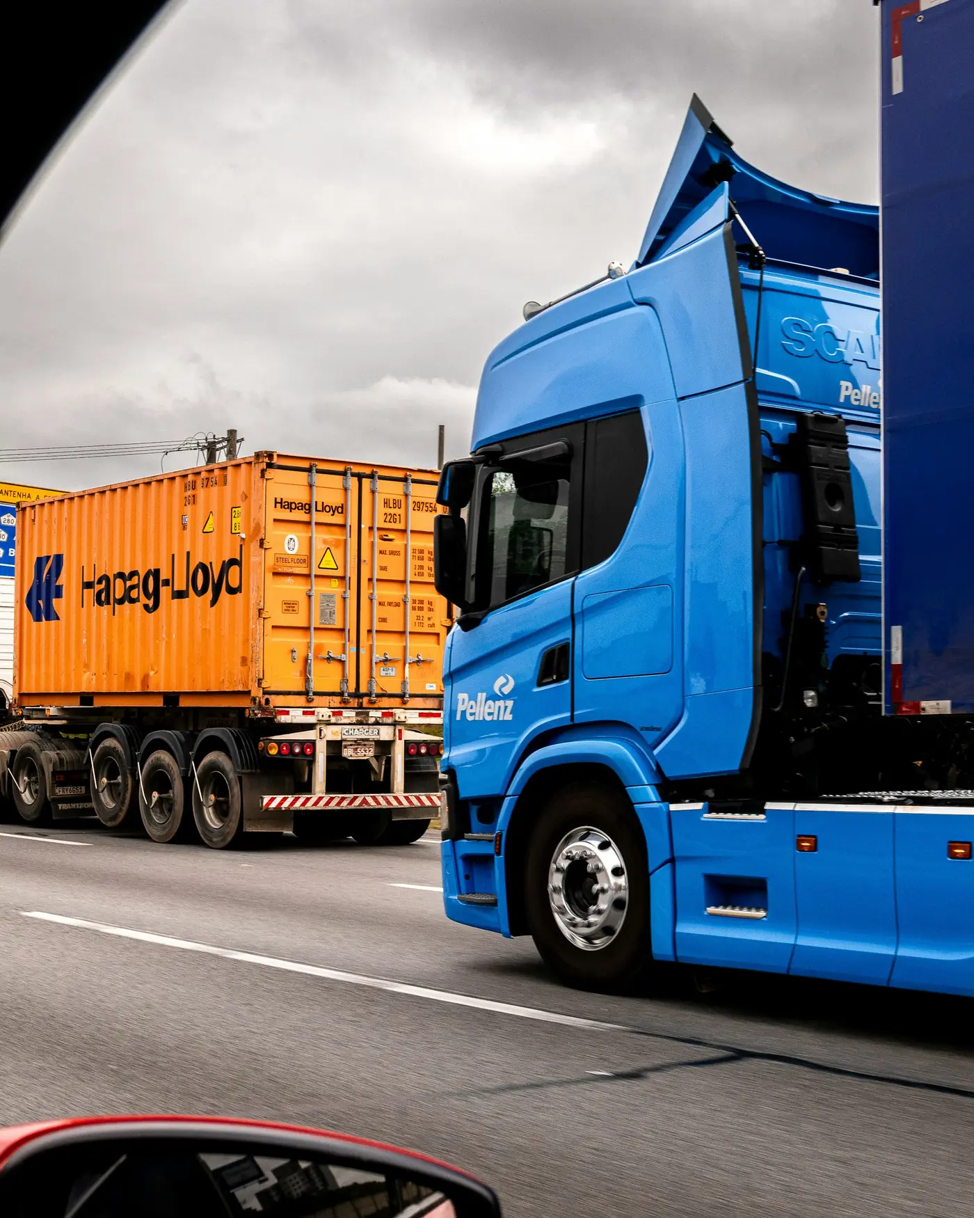 Articulated lorry with a container trailer parked at a distribution yard.