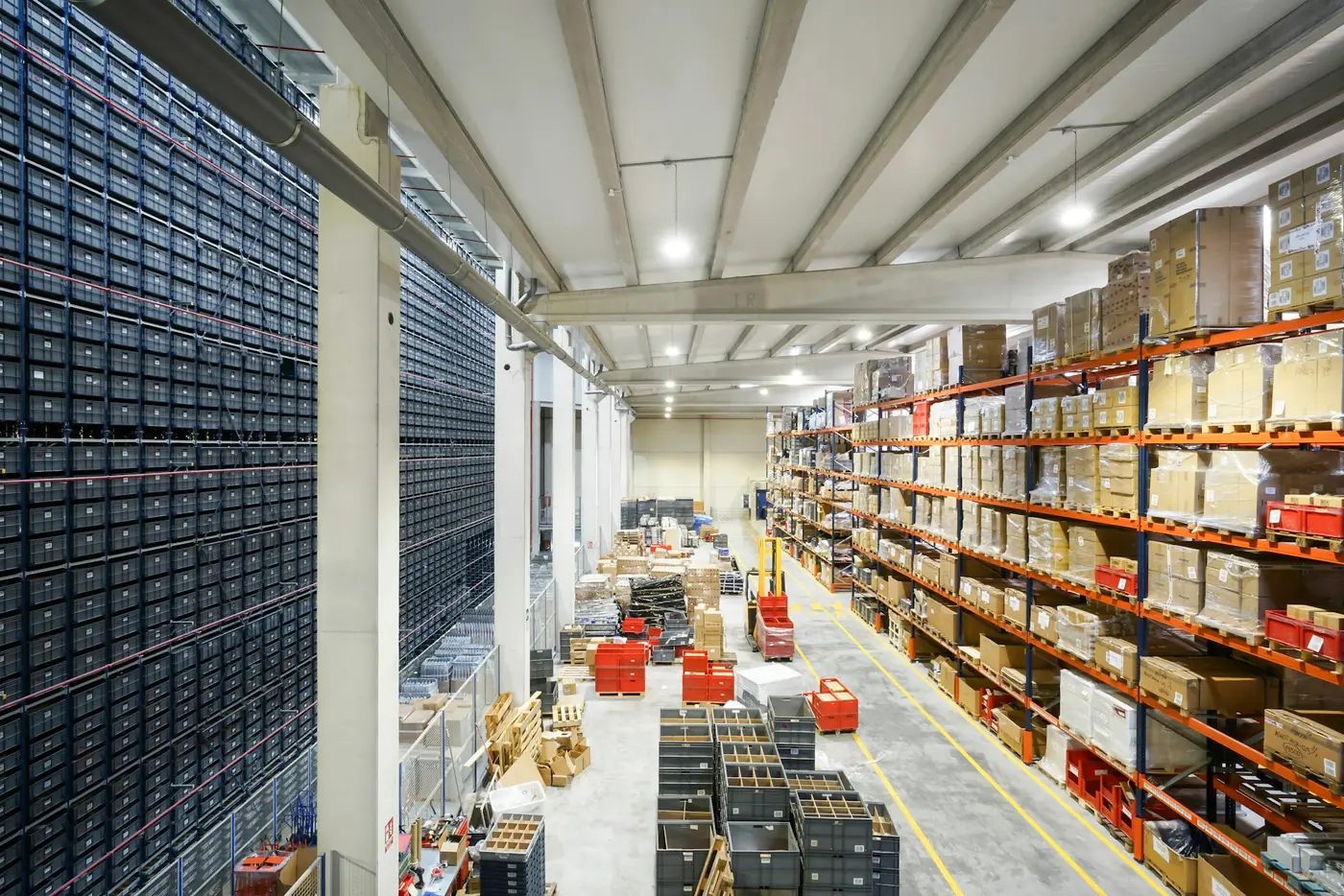 Long aisle of shelving inside a fulfilment warehouse.
